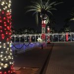 Festive seasonal lights on palm trees