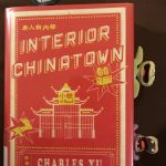 Interior Chinatown book by Charles Yu with funny animal bookmarks stuck inside the pages