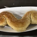 soft baked pretzel in the shape of a mustache