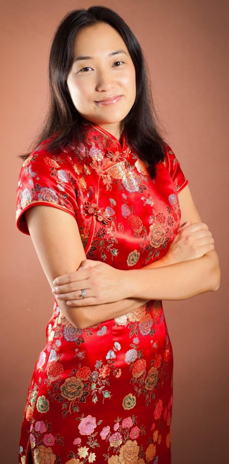 Author Jennifer J. Chow in a red qipao